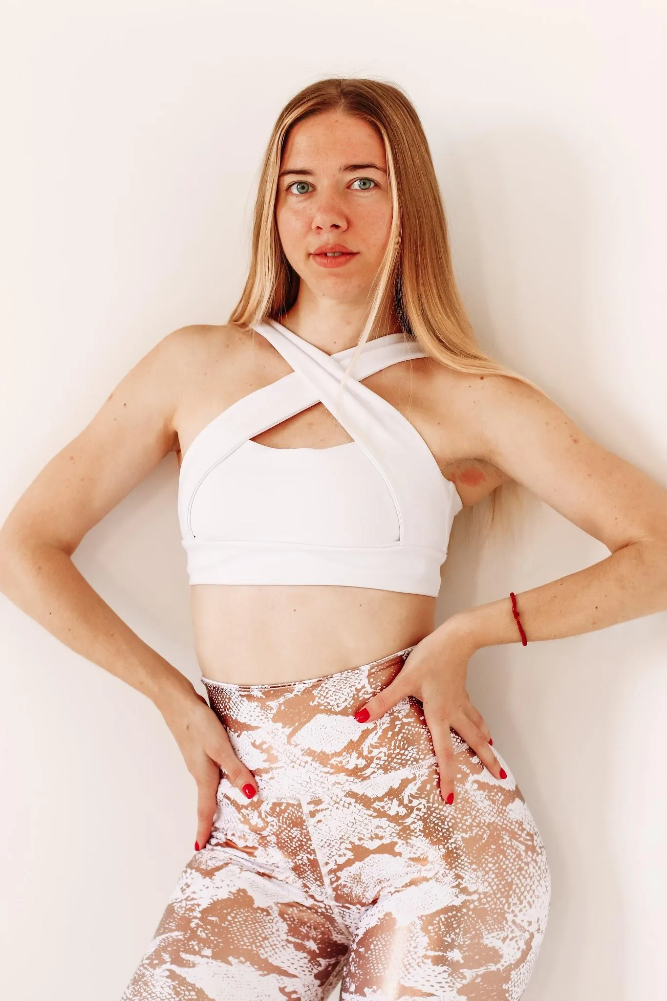 Anna Borovska, dance instructor in Basel, standing against a bright studio wall